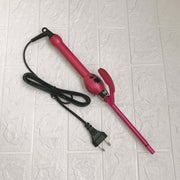 Professional 9mm Curling Iron with LCD Display in pink, showcasing the wand and cord design on a tiled surface.