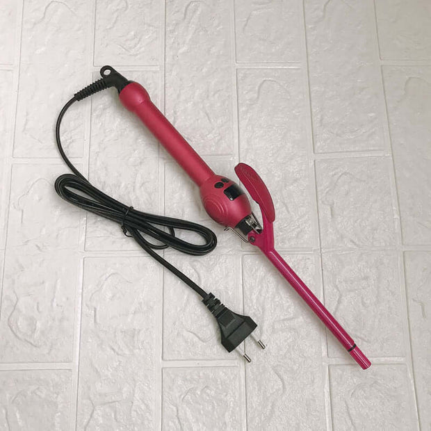 Professional 9mm Curling Iron with LCD Display in pink, showcasing the wand and cord design on a tiled surface.